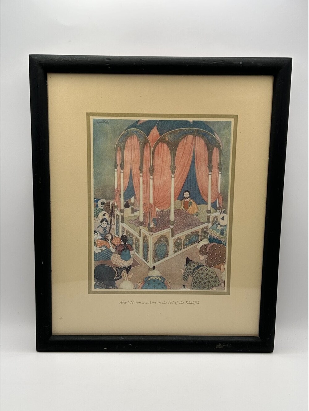 Edmund Dulac Abu-l-Hasan awakens in the bed of Khalifeh framed book black Print
